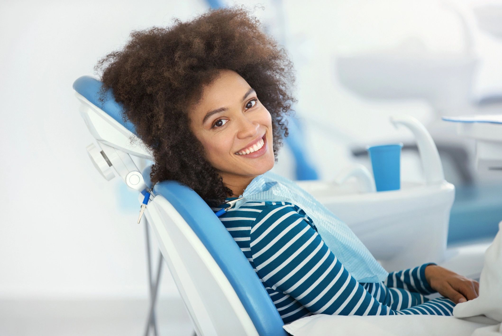 Client smiling after a successful cosmetic dental appointment